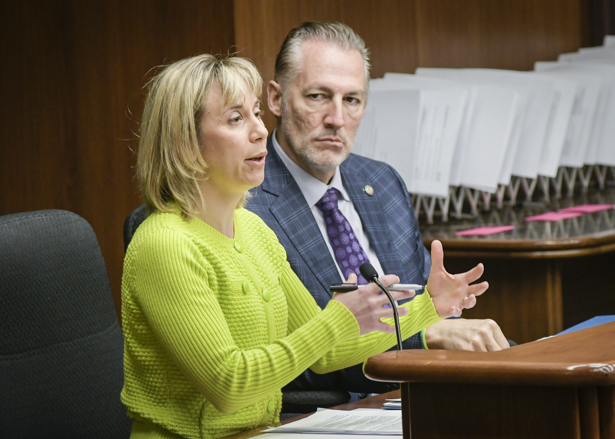 Molly Moilanen, director of Public Affairs at ClearWay Minnesota testifies before the House Health and Human Services Reform Committee March 22 in support of a bill sponsored by Rep. Dario Anselmo, right, to continue funding tobacco cessation services. Photo by Andrew VonBank